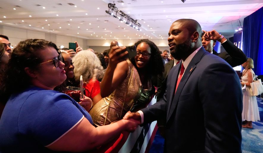 Florida Republican gubernatorial candidate Byron Donalds shakes hands with supporters during at a primary election party Tuesday, Aug. 18, 2026, in Orlando, Fla. (AP Photo/John Raoux)