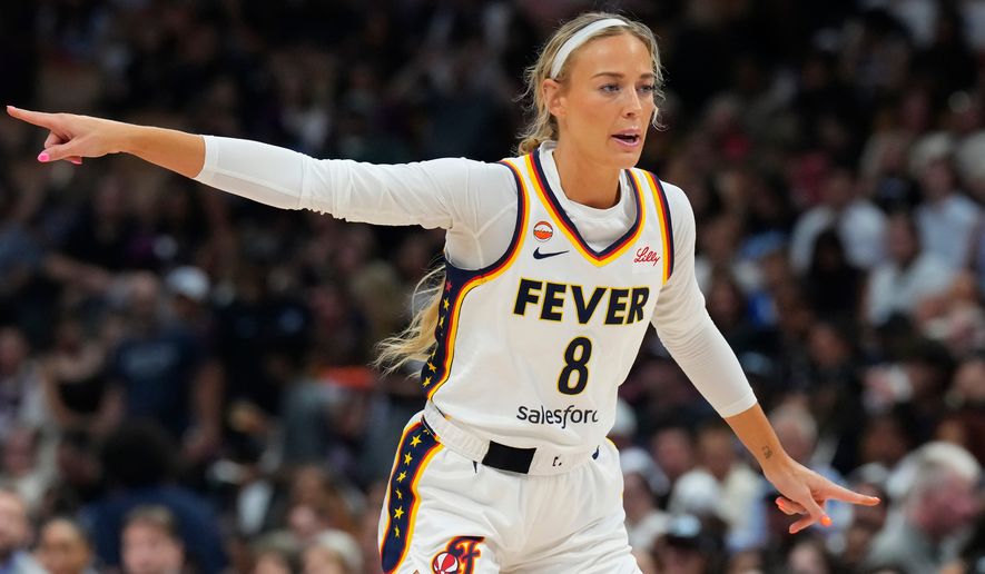 Indiana Fever's Sophie Cunningham (8) points during the first half of a WNBA basketball game in Toronto on Tuesday, Aug. 18, 2026. (Chris Young/The Canadian Press via AP)