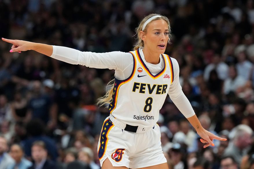 Indiana Fever's Sophie Cunningham (8) points during the first half of a WNBA basketball game in Toronto on Tuesday, Aug. 18, 2026. (Chris Young/The Canadian Press via AP)