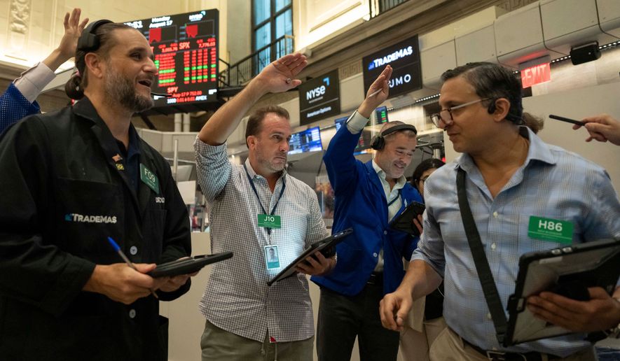 Options traders Chris Dattolo, Scott Frinzi, Justin Kanda, and Ravi Bhandari, left to right, work on the floor of the New York Stock Exchange, Monday, Aug. 17, 2026, in New York. (AP Photo/Yuki Iwamura)
