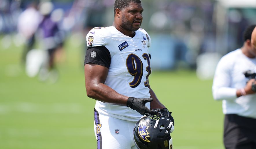 Baltimore Ravens defensive end Calais Campbell (93) watches during the team's NFL football training camp, Tuesday, Aug. 11, 2026, at the Under Armour Performance Center in Owings Mills, Md. (AP Photo/Stephanie Scarbrough)