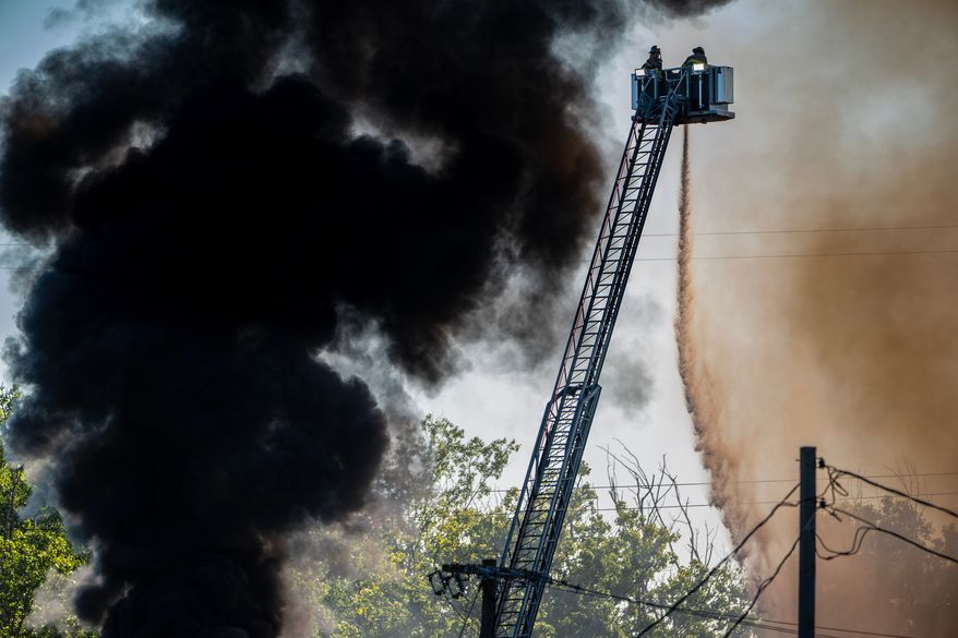 Firefighters work to put out a blaze after an explosion at Brent Industries, Tuesday, Aug. 18, 2026, in Toledo, Ohio. (Jeremy Wadsworth/The Blade via AP)