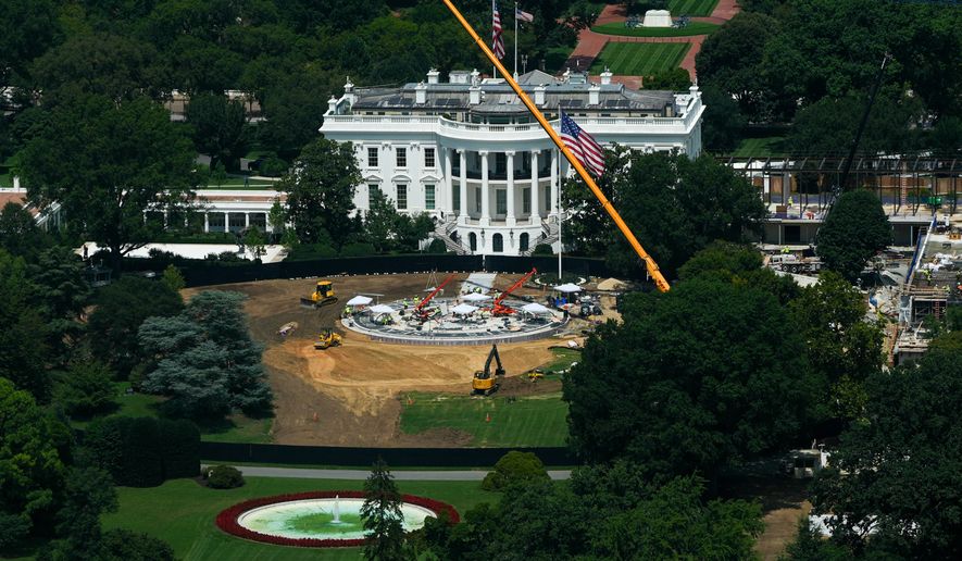 Workers build a helipad on the South Lawn of the White House, left, and continue construction on the new White House ballroom, right, as seen from the Washington Monument, Monday, Aug. 17, 2026, in Washington. (AP Photo/Julia Demaree Nikhinson)