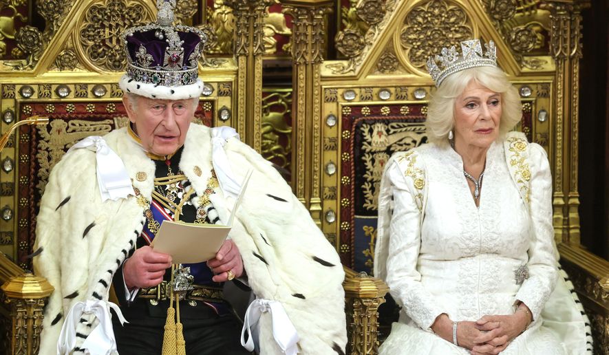 FILE - Britain's King Charles III and Queen Camilla attend the state opening of Parliament at the Palace of Westminster in London, Wednesday, May 13, 2026. (Chris Jackson/Pool Photo via AP, File)