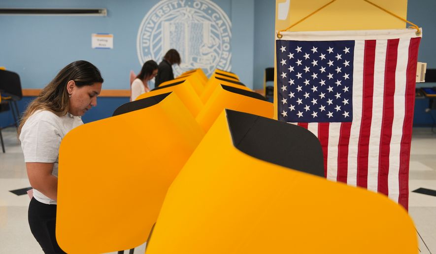 FILE - Voters cast their ballots at a voting center on the UCLA campus, June 2, 2026, in Los Angeles. (AP Photo/Jae C. Hong, File)