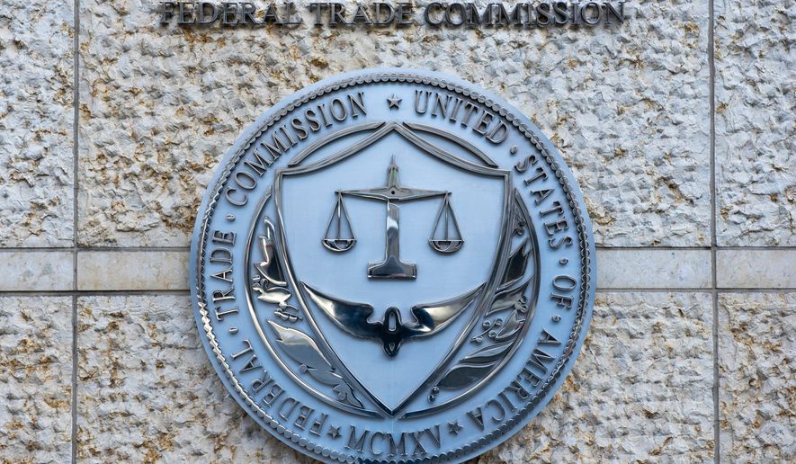 FILE - The official seal of the Federal Trade Commission is seen on an office building in Washington, Feb. 13, 2026. (AP Photo/Cliff Owen, File)