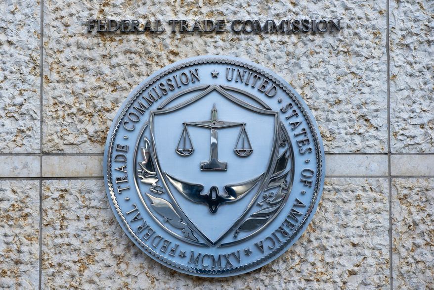 FILE - The official seal of the Federal Trade Commission is seen on an office building in Washington, Feb. 13, 2026. (AP Photo/Cliff Owen, File)