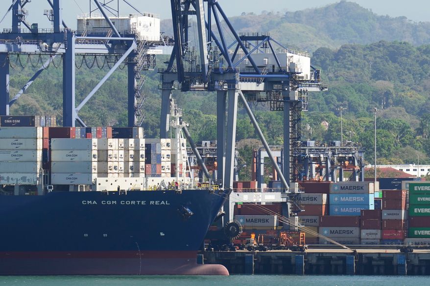 FILE - Cranes load a cargo ship at Panama Canal's Port of Balboa, managed by CK Hutchison Holdings, in Panama City, on Jan. 30, 2026. (AP Photo/Matias Delacroix, File)