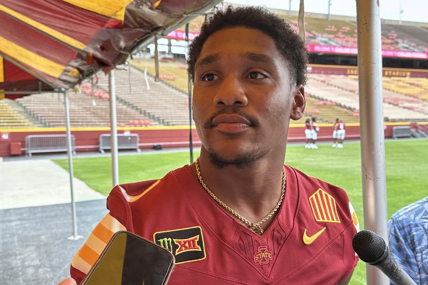 Iowa State quarterback Jaylen Raynor speaks to reporters at the team's NCAA college football media day, Wednesday, Aug. 19, 2026, in Ames, Iowa. (AP Photo/Eric Olson)