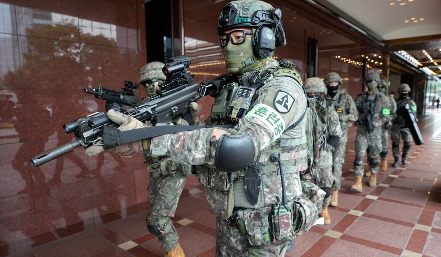 South Korea army soldiers take part in an anti-terror drill as a part of the Ulchi Freedom Shield military exercise between the U.S. and South Korea in Seoul, South Korea, Wednesday, Aug. 19, 2026. (AP Photo/Ahn Young-joon)
