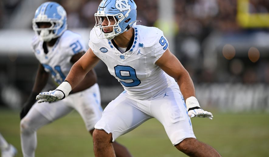 FILE - North Carolina defensive lineman Melkart Abou-Jaoude (9) follows a play against Central Florida during the second half of an NCAA football game, Sept. 20, 2025, in Orlando, Fla. (AP Photo/Phelan M. Ebenhack, File)
