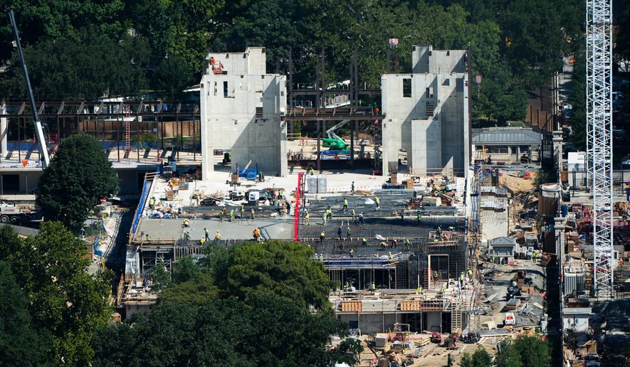 Workers continue construction on the new White House ballroom, as seen from the Washington Monument, Wednesday, Aug. 19, 2026, in Washington. (AP Photo/Alex Brandon)