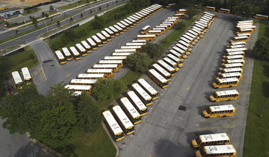 School buses are seen parked at the Montgomery County Public Schools bus depot in Derwood, Md., on Friday, July 10, 2020. (AP Photo/Julio Cortez) **FILE**