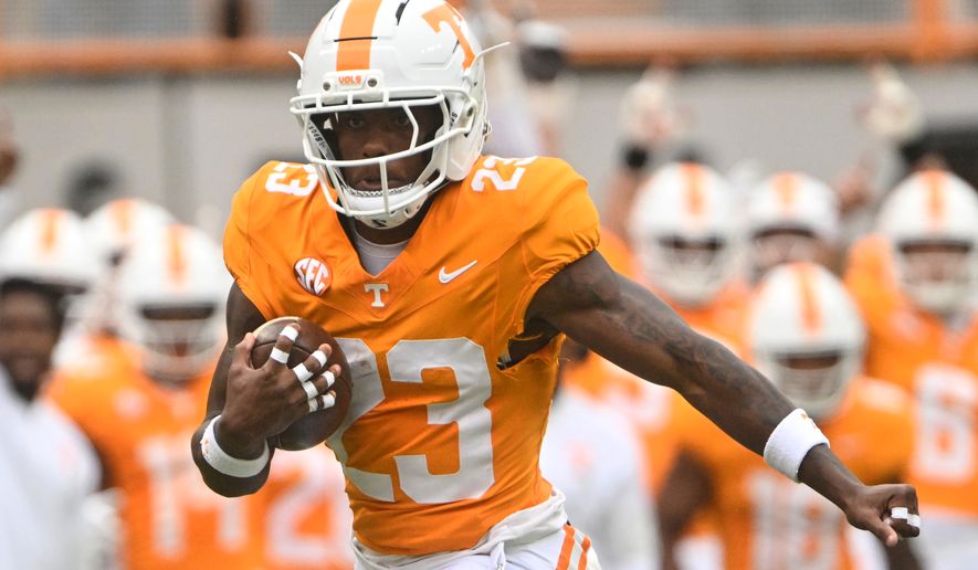 FILE - Tennessee's Boo Carter (23), who has since transferred to Colorado, runs with the ball during an NCAA football game against ETSU, Saturday, Sept. 6, 2025, in Knoxville, Tenn. (AP Photo/John Amis, File)