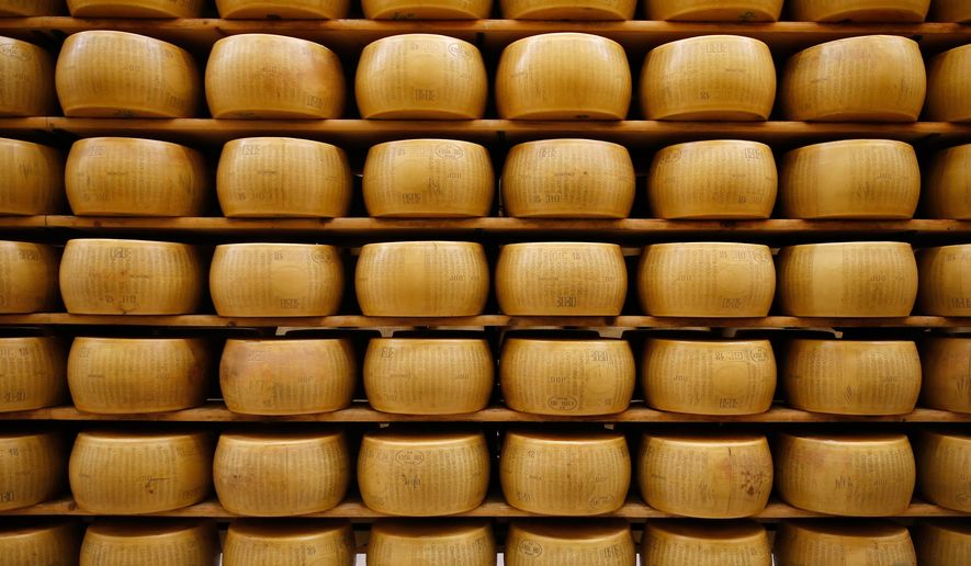 Parmigiano Reggiano Parmesan cheese wheels are stored in Noceto, near Parma, Italy, Oct. 8, 2019. (AP Photo/Antonio Calanni, File)