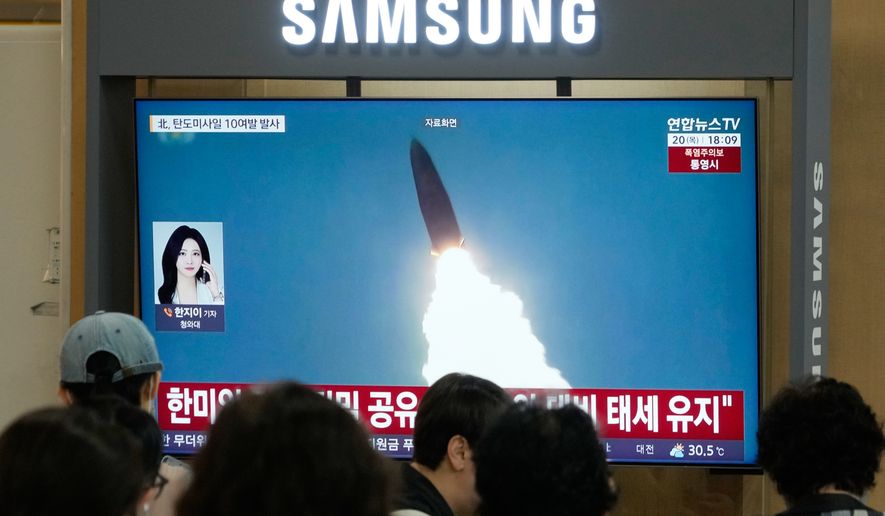 A TV screen shows a file image of North Korea's missile launch during a news program at Seoul Railway Station in Seoul, South Korea, Thursday, Aug. 20, 2026. (AP Photo/Ahn Young-joon)