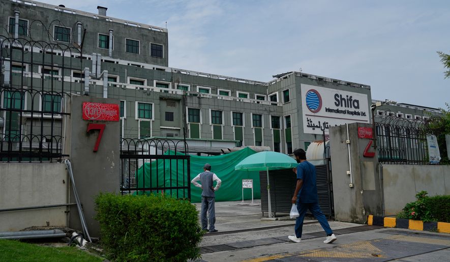 A medical personnel enters Shifa International Hospital, where imprisoned former Prime Minister Imran Khan will be transferred for a medical examination following Pakistan's Supreme Court order, in Islamabad, Pakistan, Tuesday, Aug. 18, 2026. (AP Photo/Anjum Naveed)