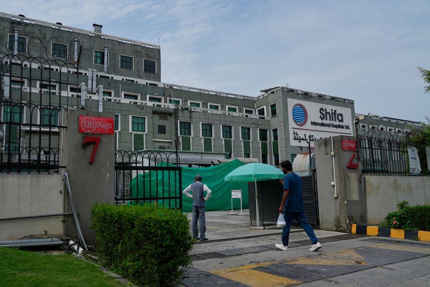 A medical personnel enters Shifa International Hospital, where imprisoned former Prime Minister Imran Khan will be transferred for a medical examination following Pakistan's Supreme Court order, in Islamabad, Pakistan, Tuesday, Aug. 18, 2026. (AP Photo/Anjum Naveed)