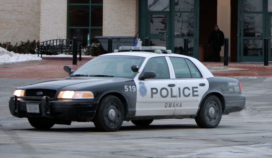 An Omaha police car drives on Dec. 8, 2007, in Omaha, Neb. (AP Photo/Jeff Roberson, File)