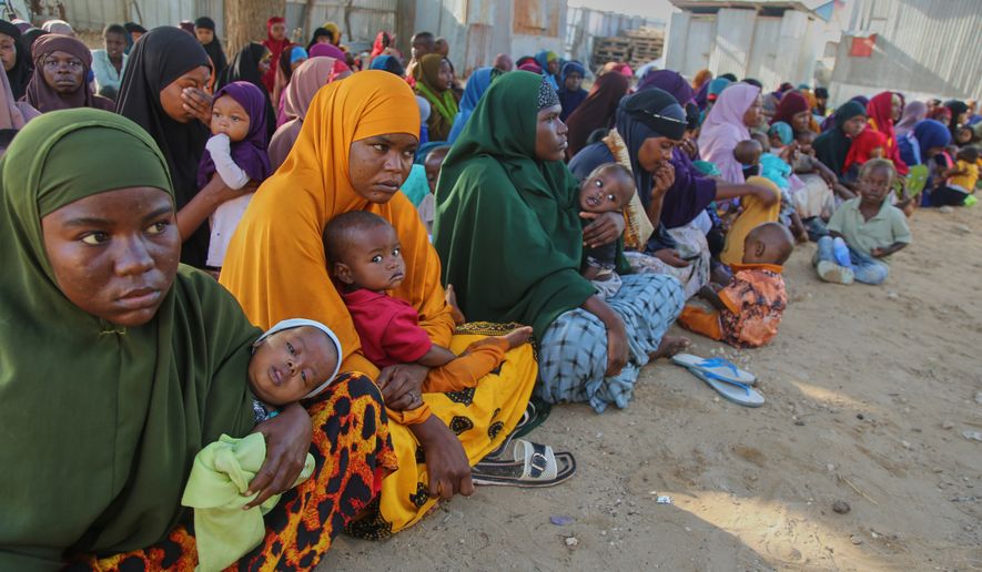 Somali women displaced by drought sit at Feynuus Nutrition Centre on the outskirts of the capital, Mogadishu, Somalia Wednesday, Aug. 19, 2026. (AP Photo/Farah Abdi Warsameh)