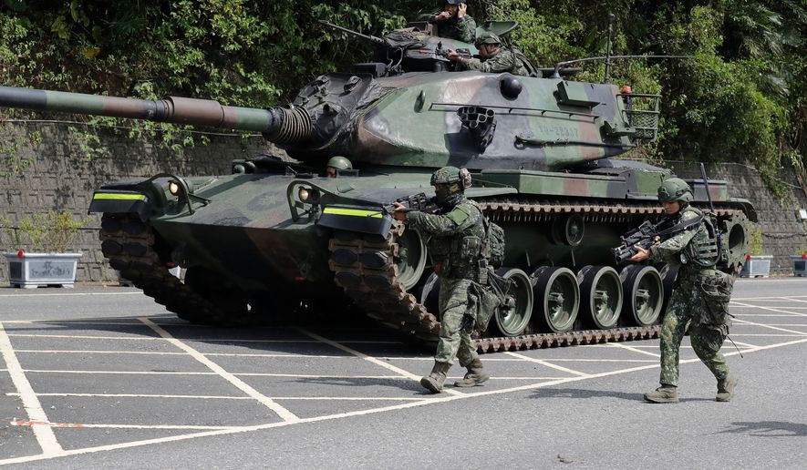 Soldiers participate in the annual Han Kuang military exercises in Yilan, northeastern Taiwan, Monday, Aug. 10, 2026. (AP Photo/Chiang Ying-ying, Pool)