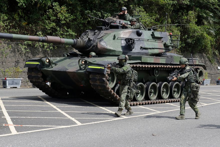 Soldiers participate in the annual Han Kuang military exercises in Yilan, northeastern Taiwan, Monday, Aug. 10, 2026. (AP Photo/Chiang Ying-ying, Pool)