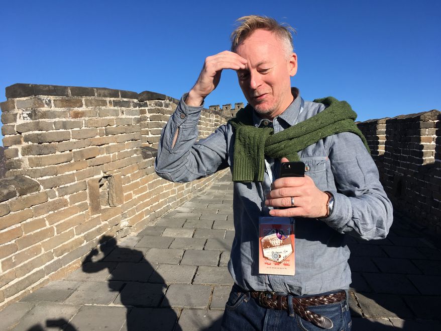 AP reporter Christopher Bodeen walks along the Mutianyu Great Wall section on the outskirts of Beijing, on Nov. 10, 2017, while covering Melania Trump’s visit to the wall. (AP Photo/Emily Wang)
