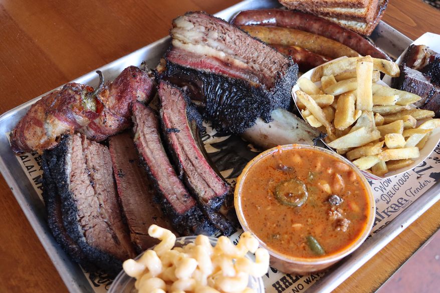 A selection from the Kafi BBQ menu, Sunday, June 28, 2026, in Irving, Texas. (Ulaa Kuziez/Religion News Service via AP)