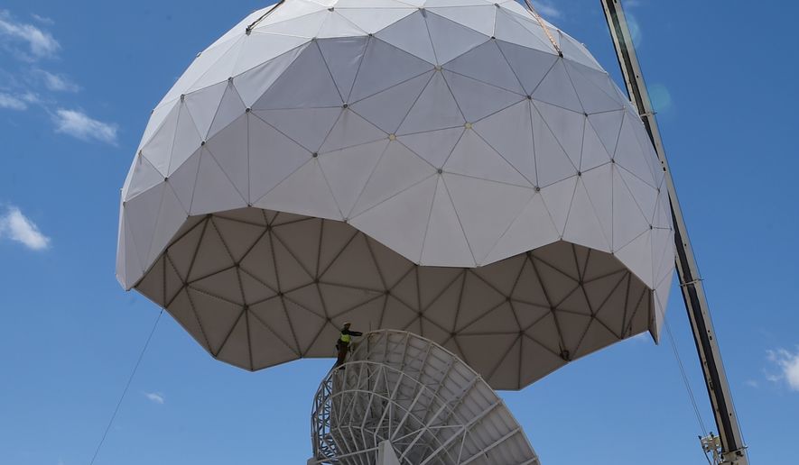 A crane removes the protective geodesic radar dome April 27, 2016, on Buckley Air Force Base, Colo. (U.S. Air Force photo by Airman 1st Class Luke W. Nowakowski/Released)