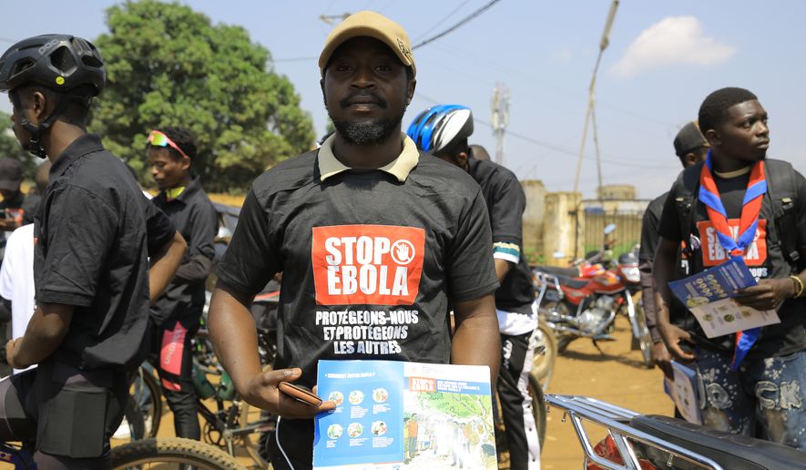 Residents and frontline workers embark on Ebola outbreak awareness campaign in Beni, North Kivu province, eastern Congo, Friday, Aug. 21, 2026. (AP Photo/Sebastien Kitsa Musayi)