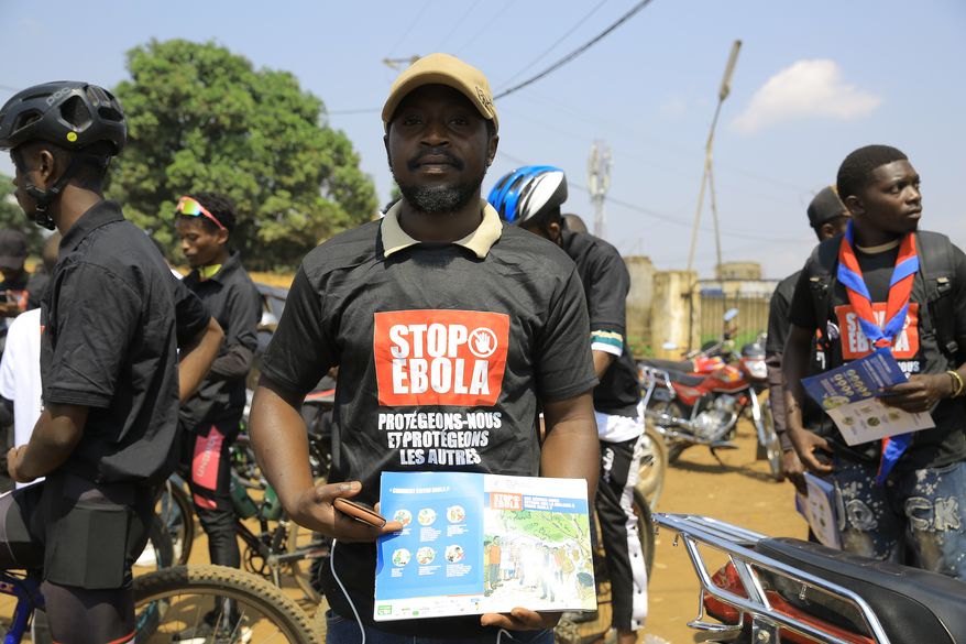 Residents and frontline workers embark on Ebola outbreak awareness campaign in Beni, North Kivu province, eastern Congo, Friday, Aug. 21, 2026. (AP Photo/Sebastien Kitsa Musayi)