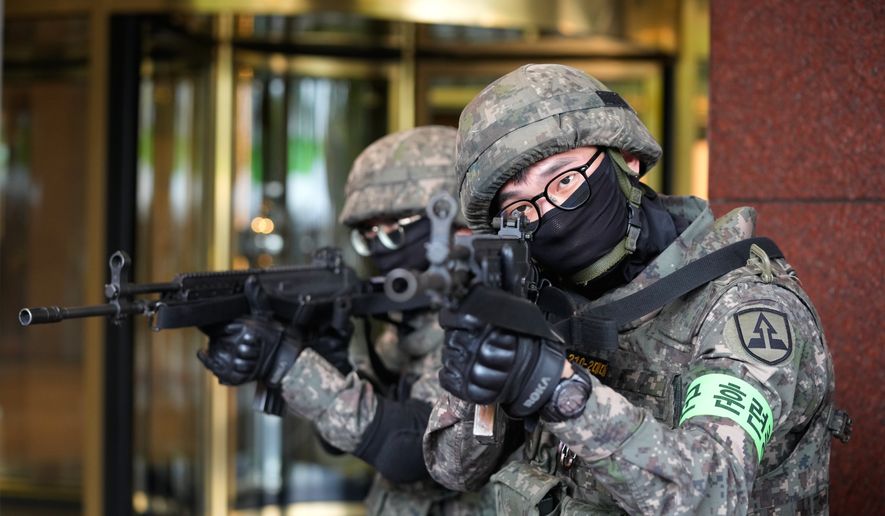South Korea army soldiers take part in an anti-terror drill as a part of the Ulchi Freedom Shield military exercise between the U.S. and South Korea in Seoul, South Korea, Wednesday, Aug. 19, 2026. (AP Photo/Ahn Young-joon)