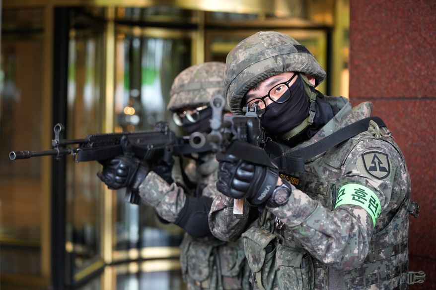 South Korea army soldiers take part in an anti-terror drill as a part of the Ulchi Freedom Shield military exercise between the U.S. and South Korea in Seoul, South Korea, Wednesday, Aug. 19, 2026. (AP Photo/Ahn Young-joon)