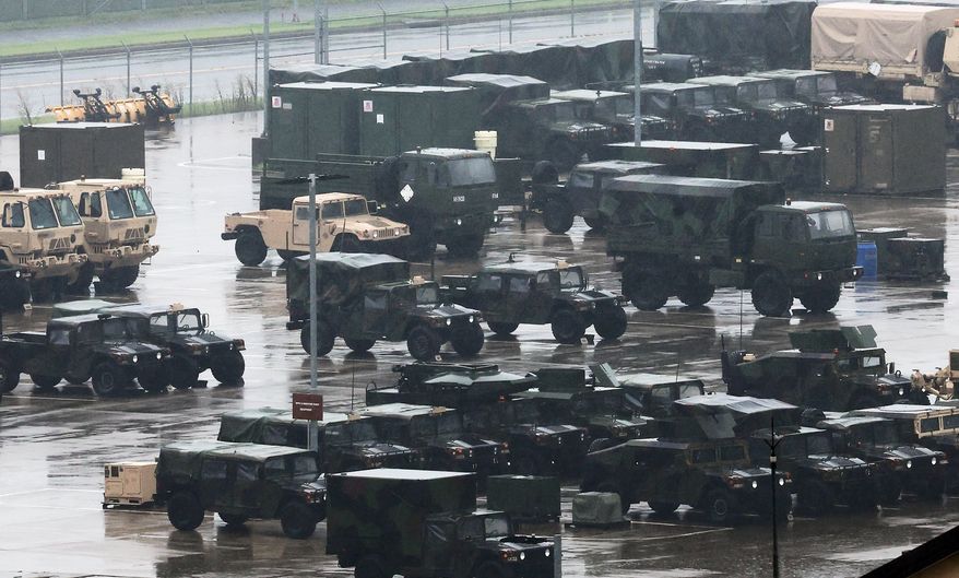 U.S. military vehicles are parked at Camp Humphreys in Pyeongtaek, South Korea, Friday, Aug. 21, 2026. (Hong Ki-won/Yonhap via AP)