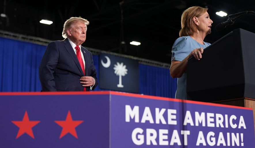 Sen. Darline Graham, R-S.C., speaks as President Donald Trump listens at a campaign rally for Graham at the Myrtle Beach Convention Center in Myrtle Beach, S.C., Friday, Aug. 21, 2026. (AP Photo/Jacquelyn Martin)