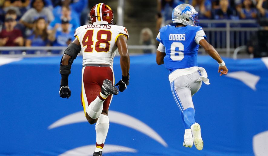 Detroit Lions quarterback Joshua Dobbs (6) runs in for a touchdown against Washington Commanders Joshua Josephs (48) during a preseason NFL football game, Saturday, Aug. 22, 2026, in Detroit. (AP Photo/Rey Del Rio)