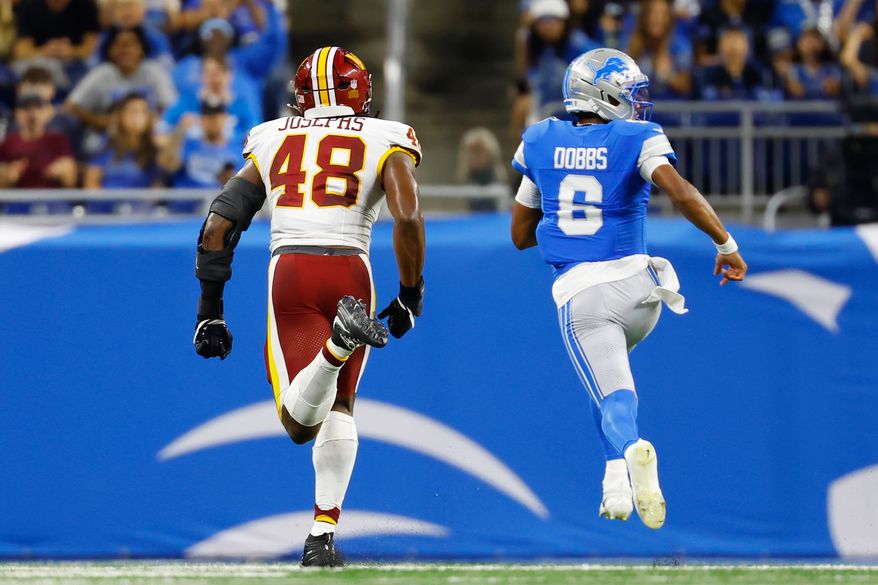 Detroit Lions quarterback Joshua Dobbs (6) runs in for a touchdown against Washington Commanders Joshua Josephs (48) during a preseason NFL football game, Saturday, Aug. 22, 2026, in Detroit. (AP Photo/Rey Del Rio)