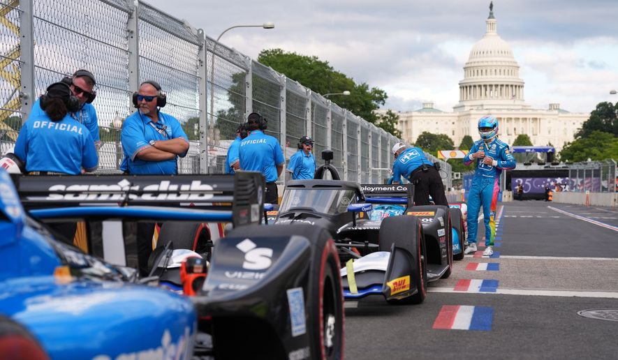 Race car diver Scott McLaughlin gets out of his car after a qualifying race prior to Sunday's Freedom 250 Grand Prix auto race in Washington, Saturday, Aug. 22, 2026.(AP Photo/Alex Brandon)
