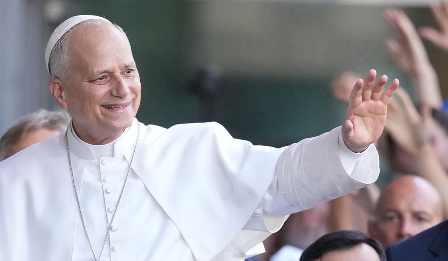 Pope Leo XIV greets faithful as he arrives at the 47th Meeting for Friendship Among Peoples in Rimini, Italy, Saturday, Aug. 22, 2026. (AP Photo/Andrew Medichini)