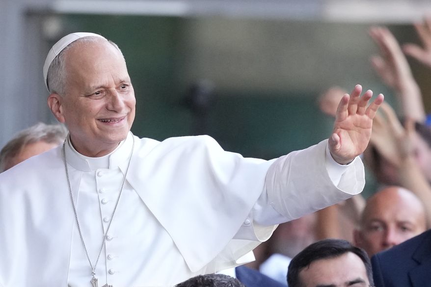 Pope Leo XIV greets faithful as he arrives at the 47th Meeting for Friendship Among Peoples in Rimini, Italy, Saturday, Aug. 22, 2026. (AP Photo/Andrew Medichini)