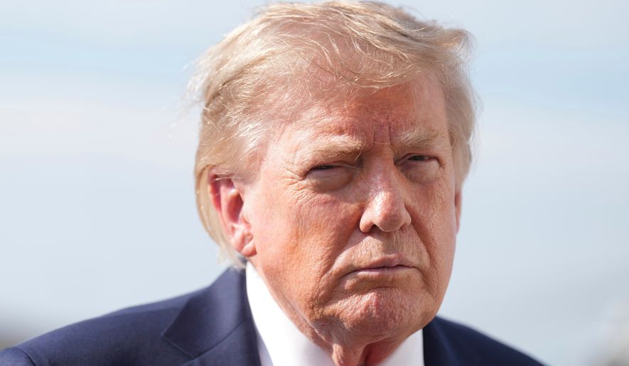 President Donald Trump speaks with reporters before boarding Air Force One, Friday, Aug. 21, 2026, at Joint Base Andrews, Md., en route to South Carolina. (AP Photo/Jacquelyn Martin)