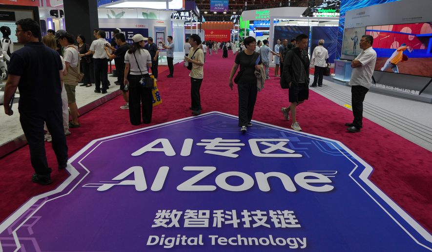 Visitors tour the exhibition booths operated by artificial intelligence at the China International Supply Chain Expo in Beijing on June 25, 2026. (AP Photo/Andy Wong) ** FILE **