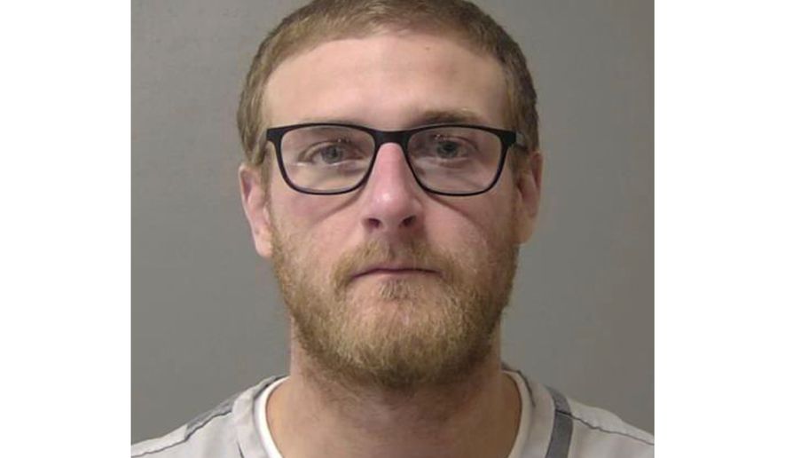 FILE - This booking photo provided by the Macon County, Ill., Jail in January 2025, shows Sean Grayson, a former Sangamon County Sheriff's deputy who is charged with first-degree murder in the shooting death of Sonya Massey on July 6, 2024, in Springfield, Ill. (Macon County Jail via AP, File)
