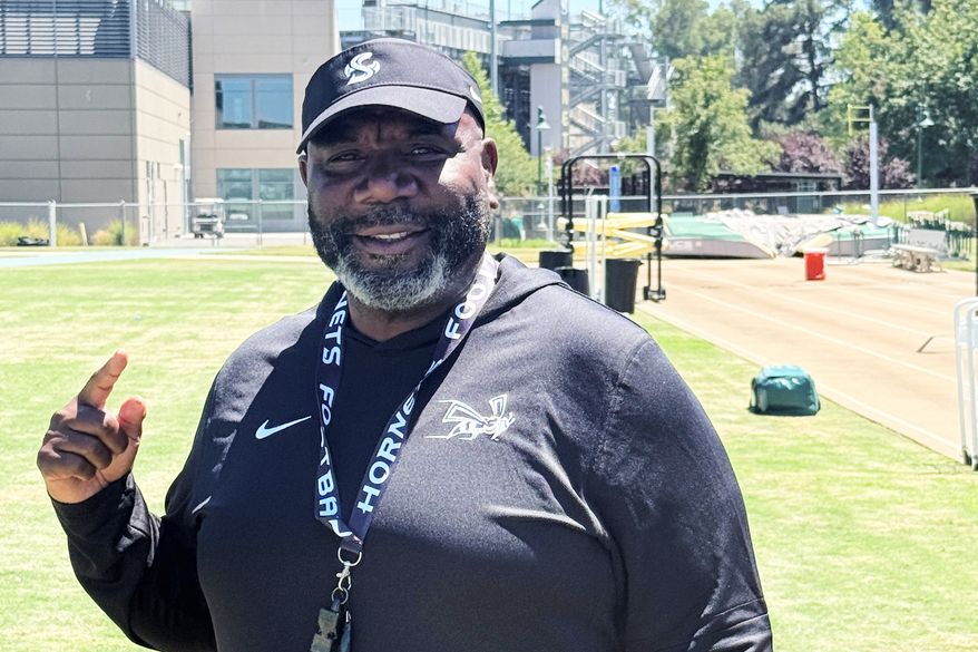 Sacramento State football coach Alonzo Carter poses for a photo on campus on Friday, July 31, 2026 in Sacramento, Calif. (AP Photo/Josh Dubow)