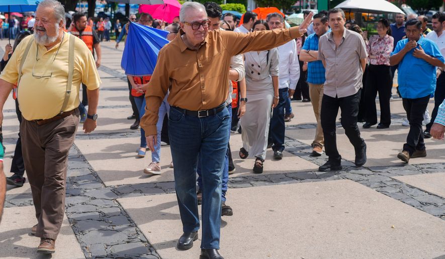 FILE - Sinaloa state Gov. Ruben Rocha waves as he takes part in an annual earthquake drill in Culiacan, Mexico, Sept. 19, 2024. (AP Photo/Eduardo Verdugo, File)