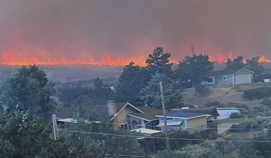 This image provided by Cari Kieffer shows part of the Hawk fire in Reno, Nev. (Cari Kieffer via AP)