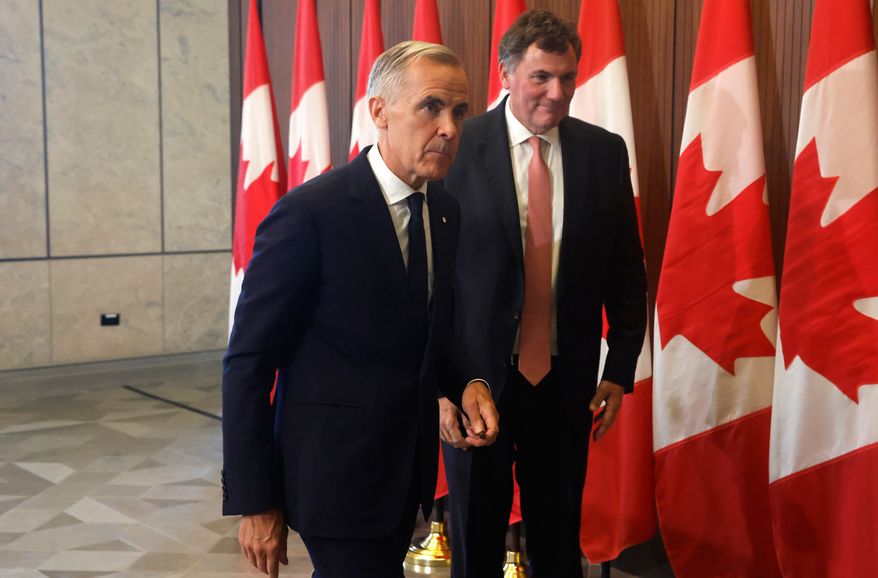 Prime Minister Mark Carney and Canada-U.S. Trade Minister Dominic LeBlanc leave a news conference about Canada's response to new U.S. tariffs on Parliament Hill in Ottawa on Saturday, Aug. 22, 2026. (Patrick Doyle/The Canadian Press via AP)