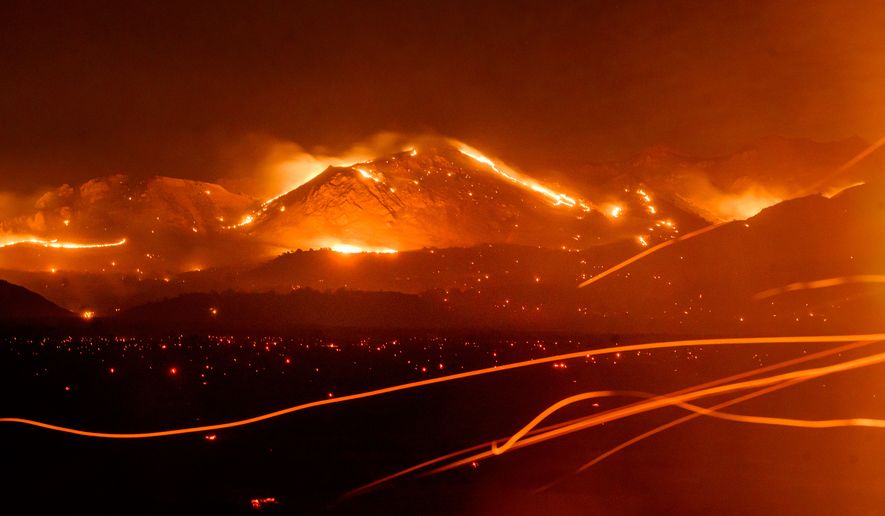 FILE - The Bug Fire burns near Doyle in unincorporated Lassen County, Calif., Aug. 13, 2026. (AP Photo/Noah Berger, File)