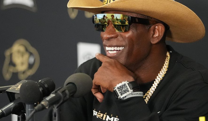 Colorado head coach Deion Sanders talks to reporters after practice at an NCAA college football training camp in Fountain, Colo., Thursday, Aug. 6, 2026. (AP Photo/David Zalubowski)