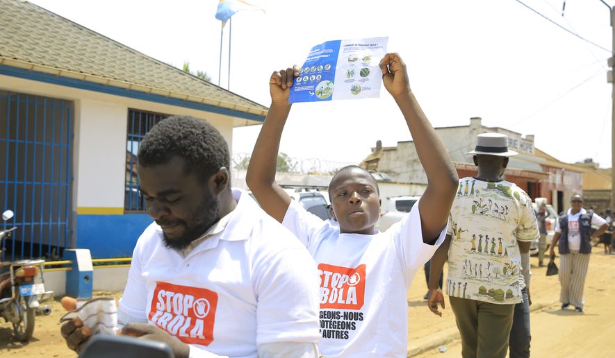 Residents and frontline workers embark on Ebola outbreak awareness campaign in Beni, North Kivu province, eastern Congo, Friday, Aug. 21, 2026. (AP Photo/Sebastien Kitsa Musayi)